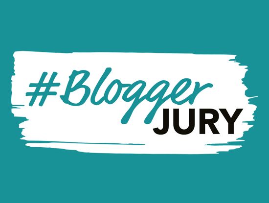 Logo mit dem Text '#BloggerJury' in türkis und schwarz auf weißem Hintergrund.