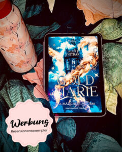 Das blaue Cover von „Goldmarie – Das Mädchen im Turm“ von Alex J. Nitrak liegt zwischen bunten Stoffblättern.